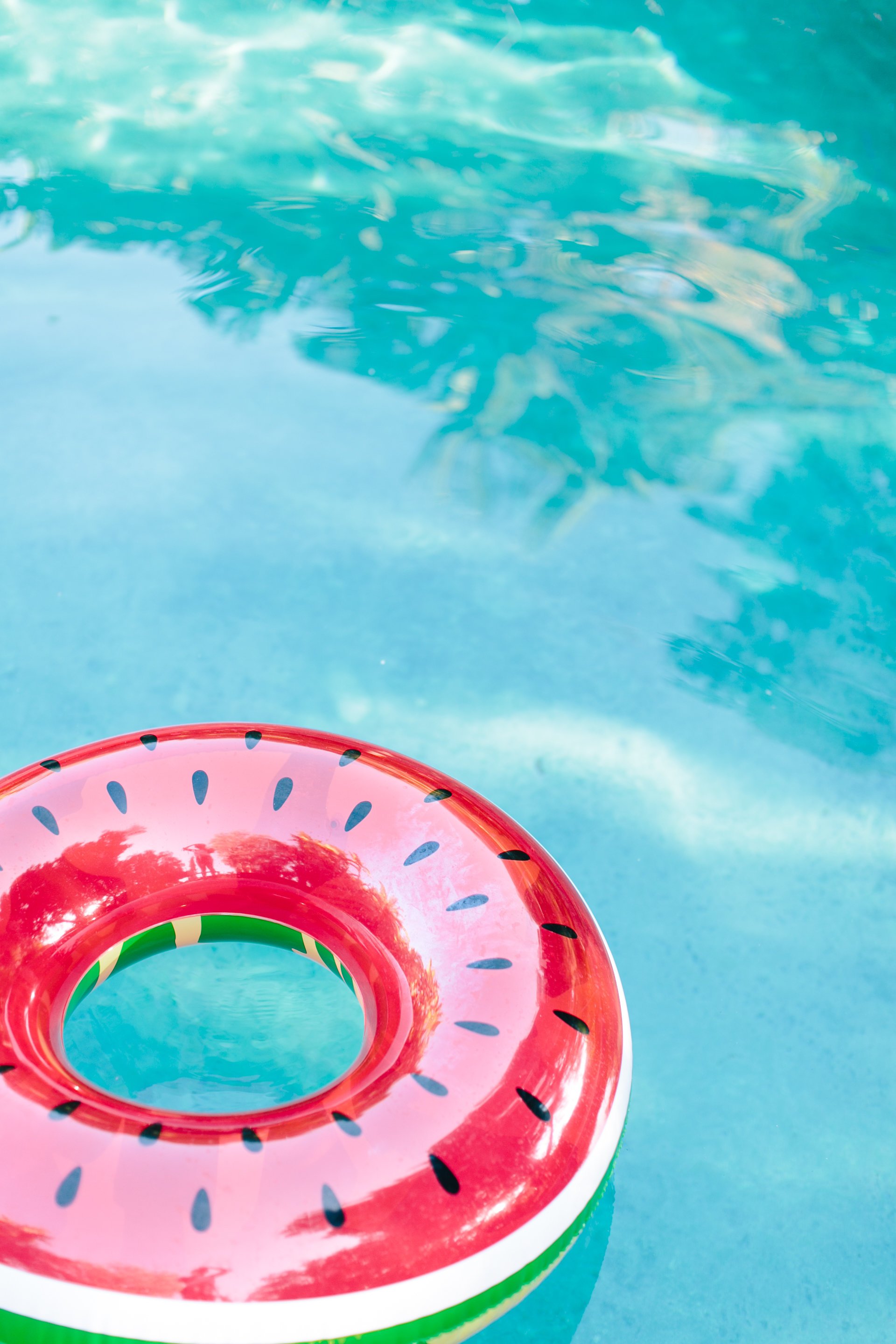 watermelon floatie in a swimming pool